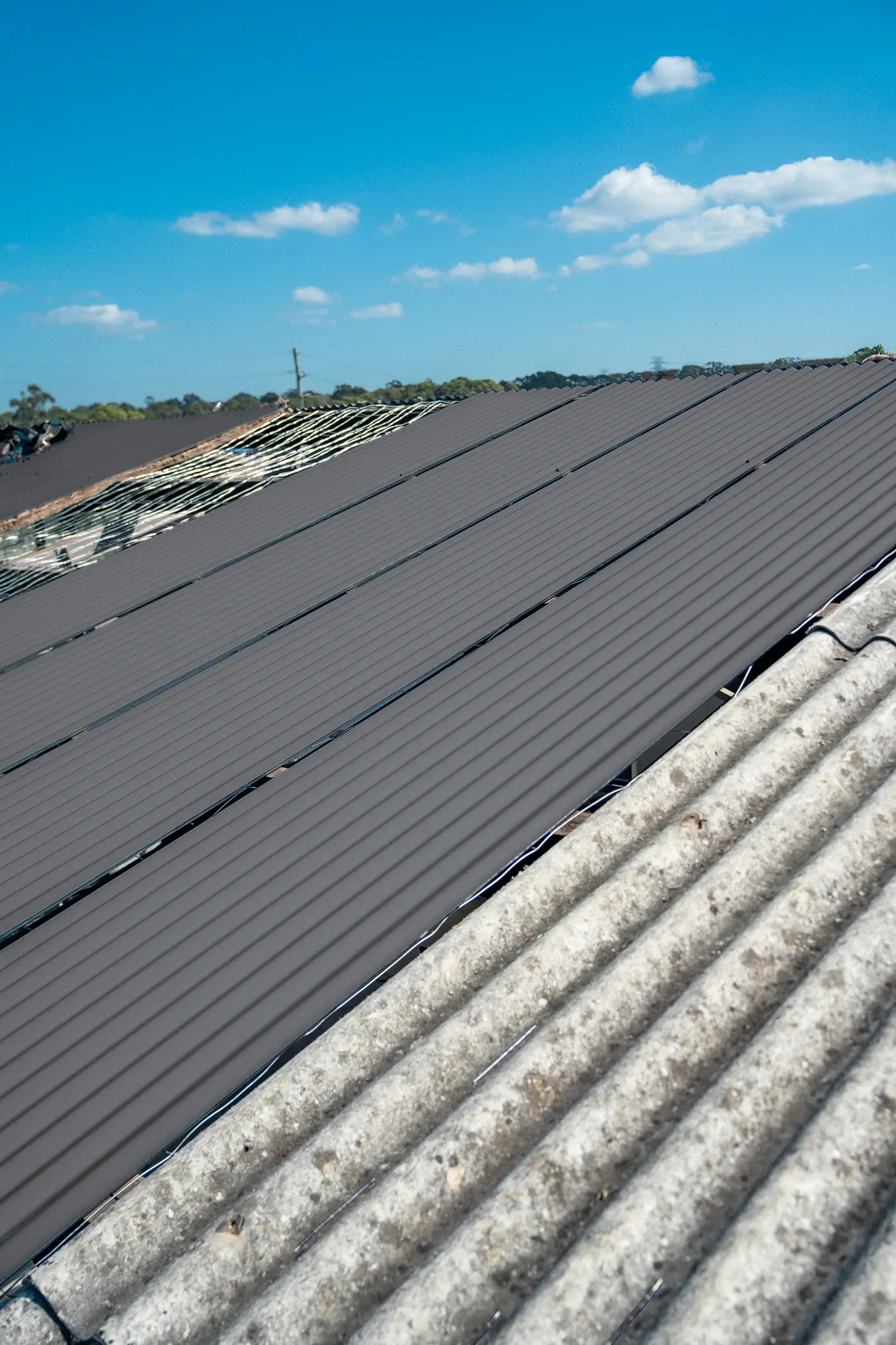 New roof sheets on an AD Roofing job, previewed in Basalt® COLORBOND®