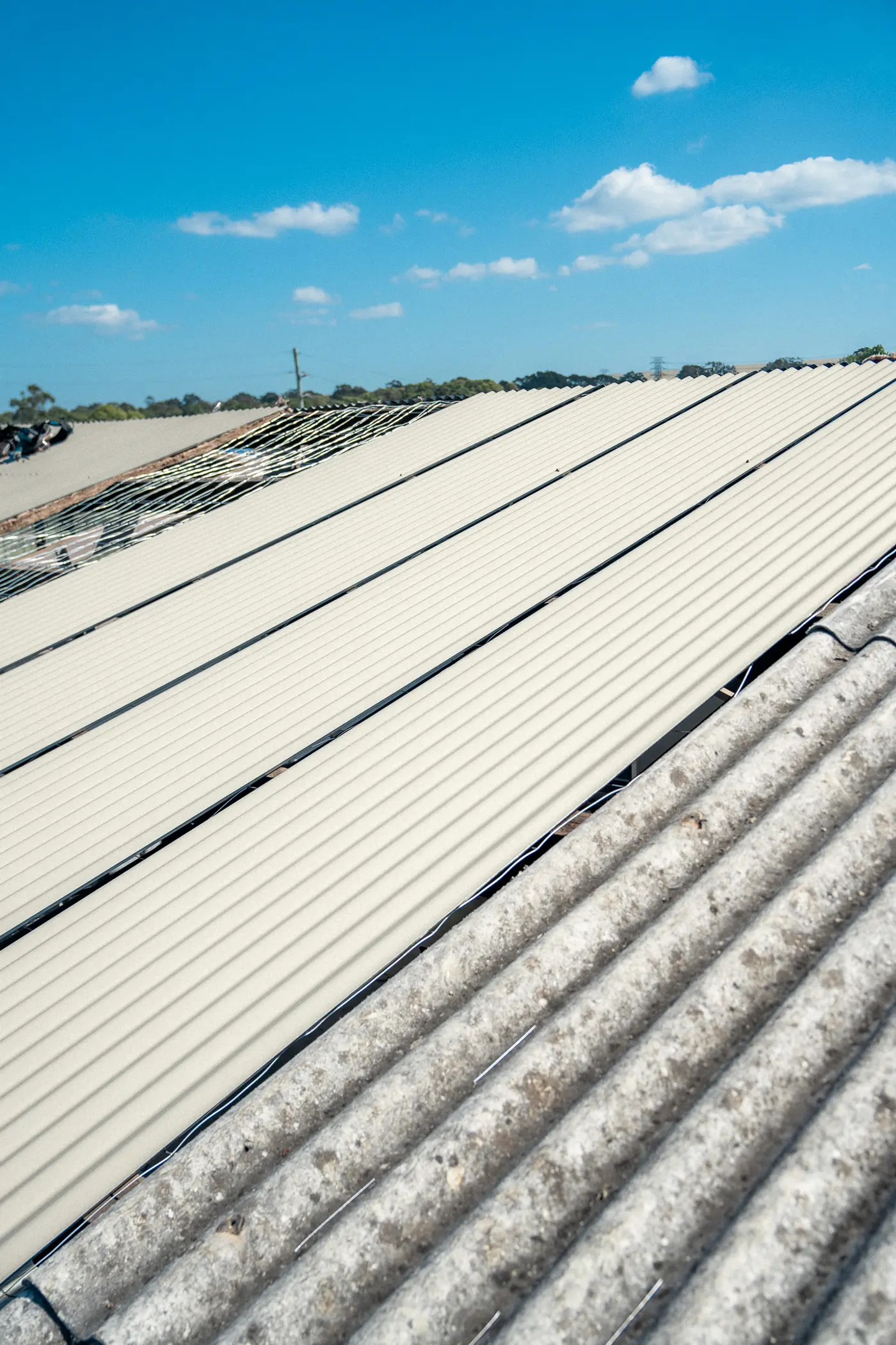 New roof sheets on an AD Roofing job, previewed in Surfmist® COLORBOND®